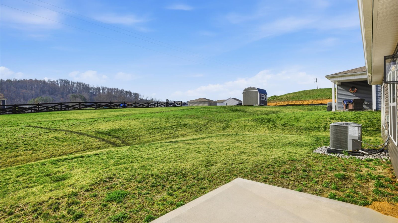 patio and lush sodded back yard