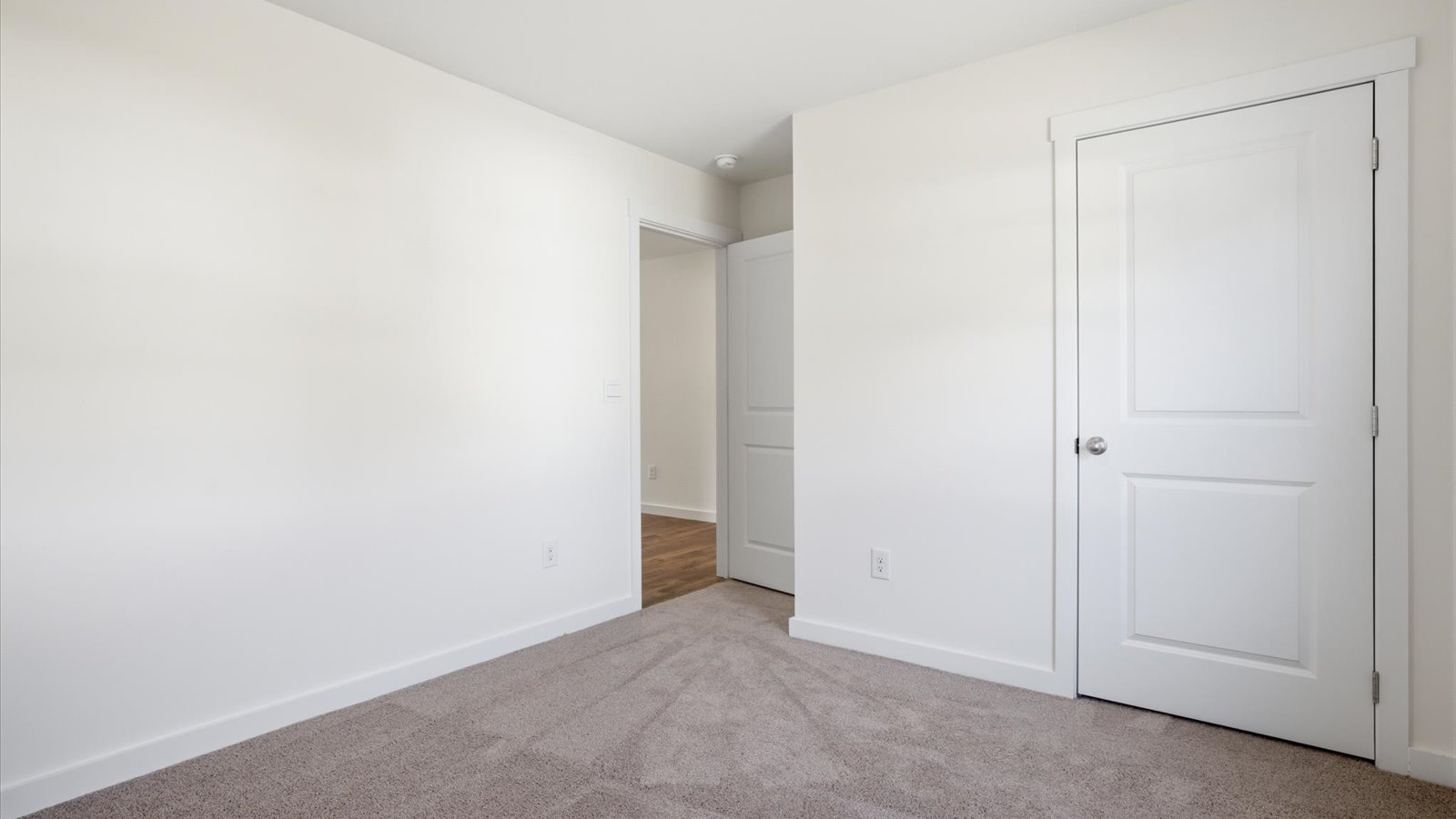 front bedroom with carpet and lots of natural light