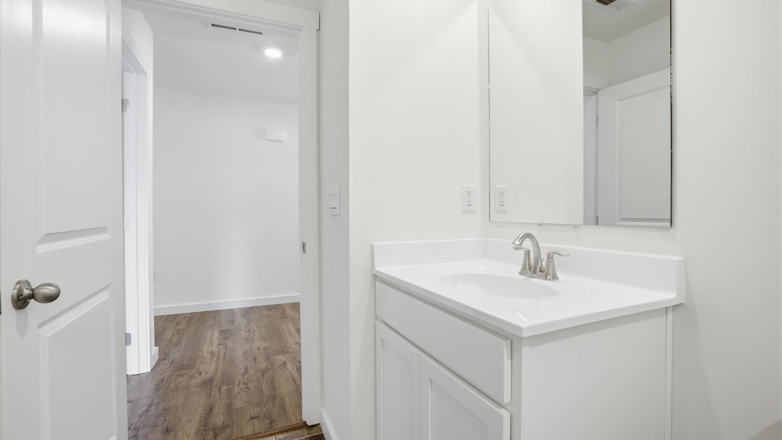 single bowl vanity with mirror and vanity lighting