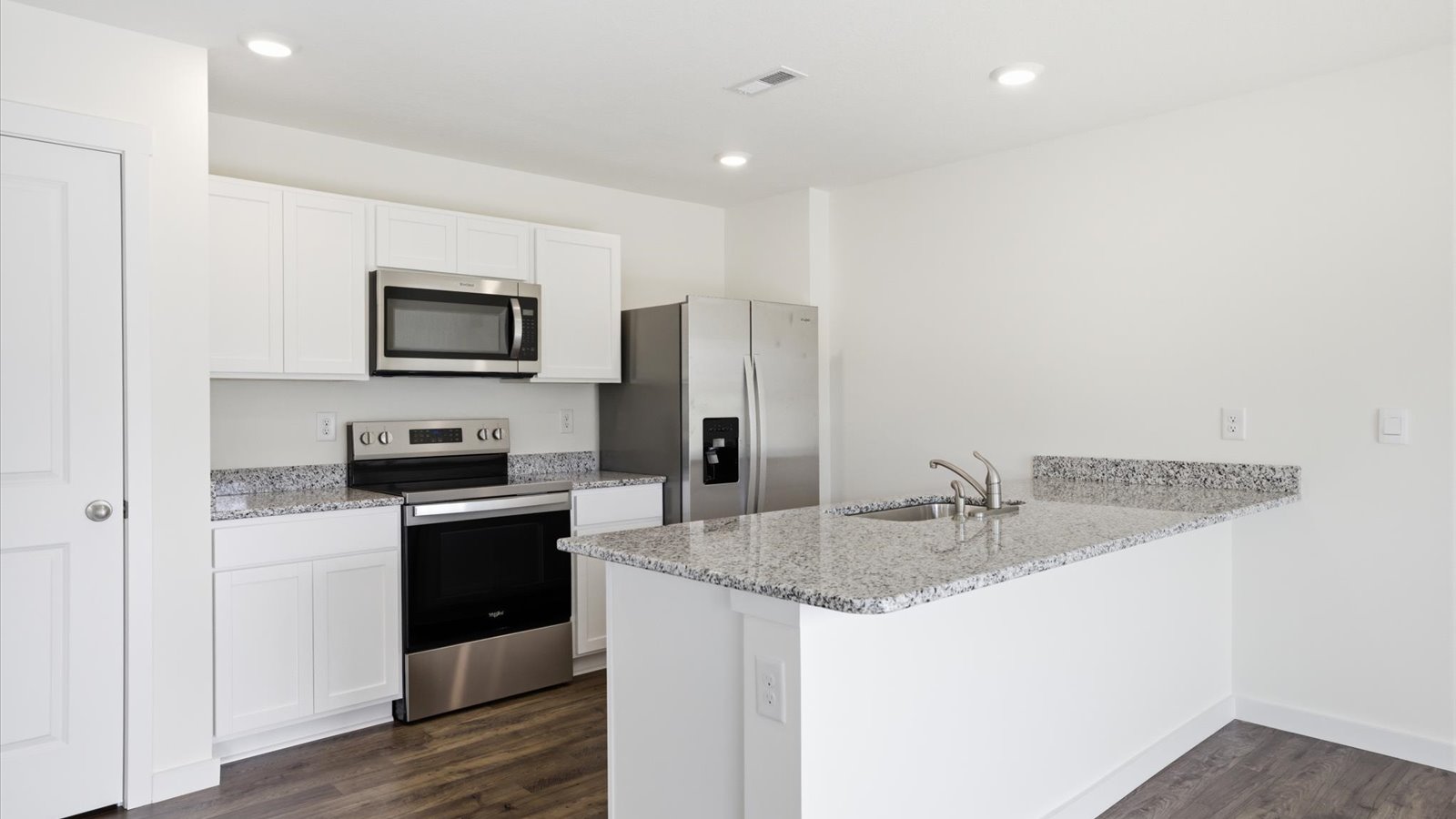 kitchen with refrigerator microwave electric range and dishwasher