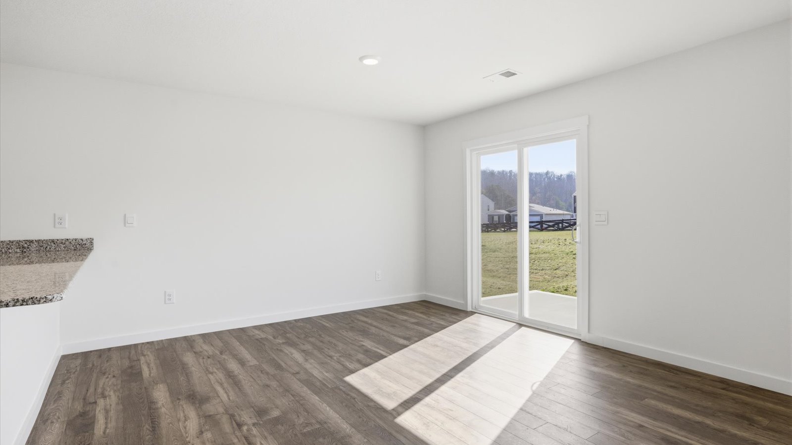 dining area adjacent to kitchen that and sliding glass doors that lead to patio