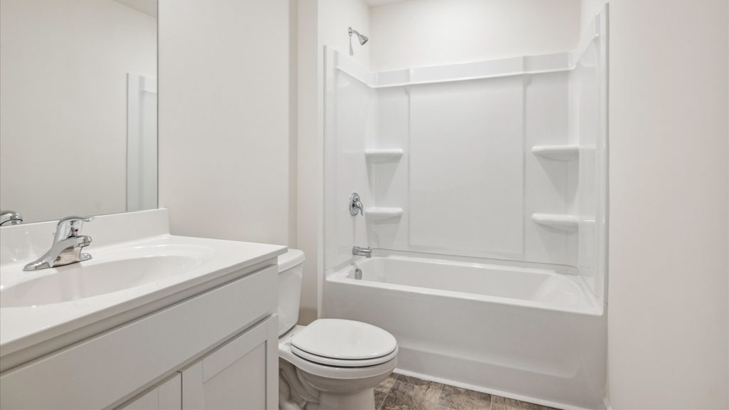 Private attached primary bathroom with built in vanity