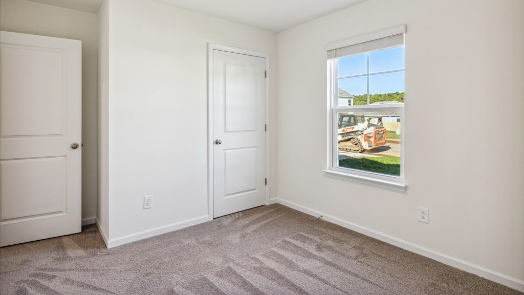 Second bedroom, flex-office, study, entertainment, game, craft room options in this D.R. Horton new construction home