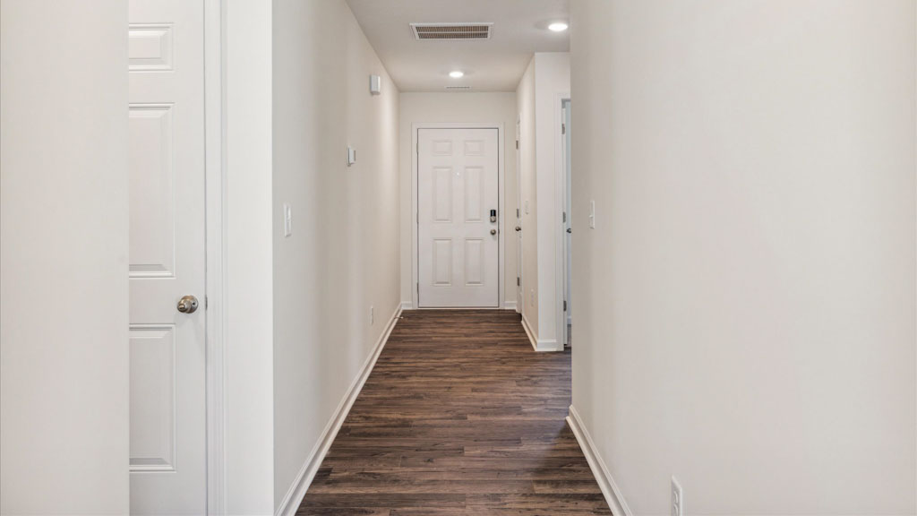 A foyer and entry hall combination features a welcoming front with a direct line of sight through the main living areas