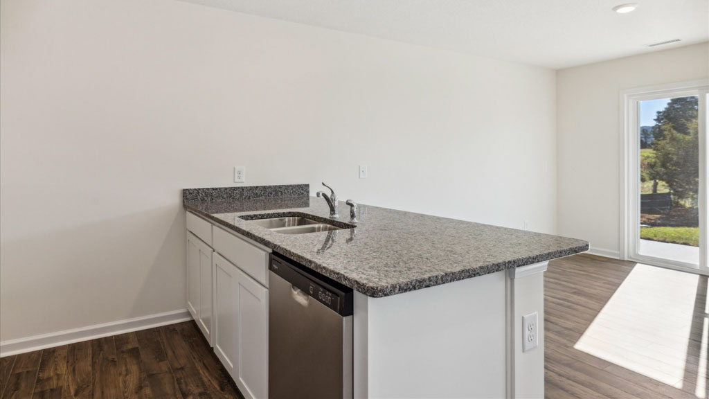 Spacious open concept kitchen with island and counter prep space