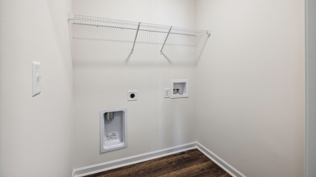 Laundry room and utility closet space with extra storage
