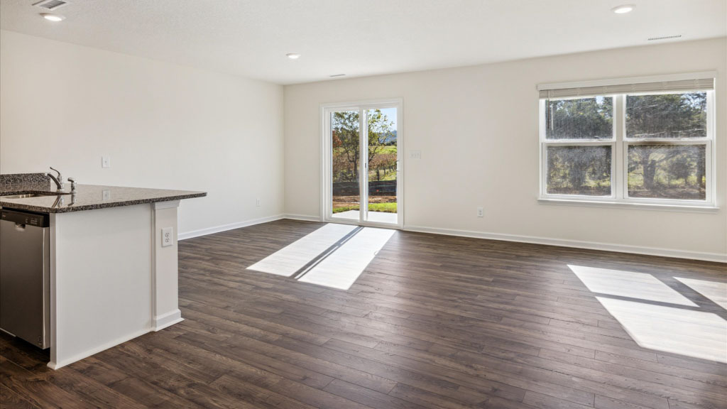 Central kitchen anchors the home adding a dining option, full sink, pantry and storage, multi-prep zones
