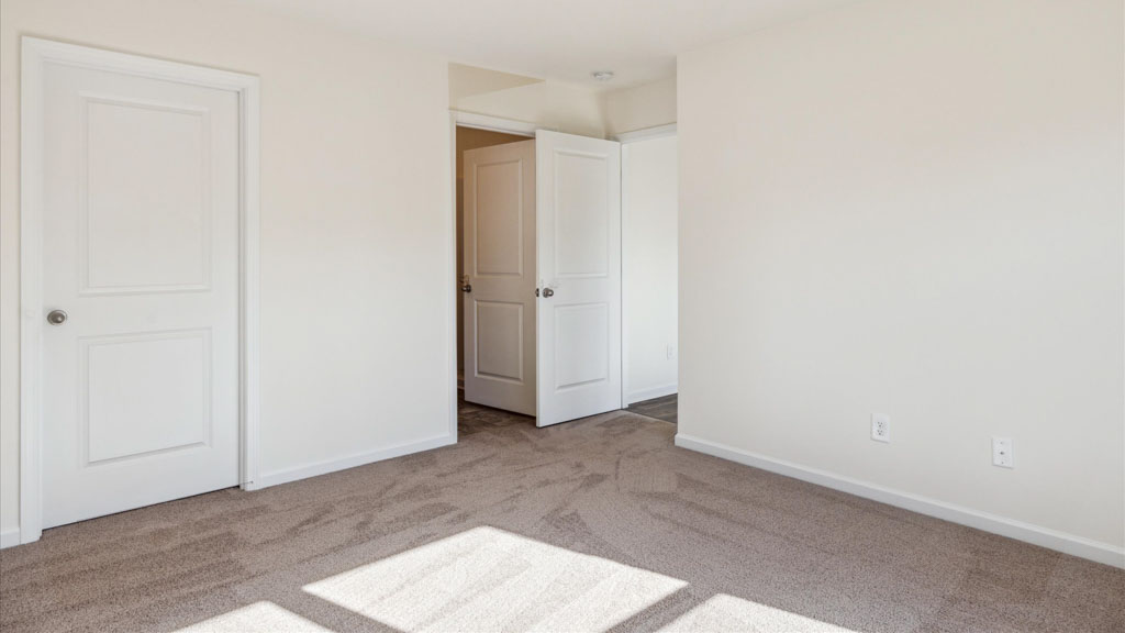 Primary bedroom designed with privacy and space in mind with a flow into a spa-inspired ensuite bathroom and walk-in closet