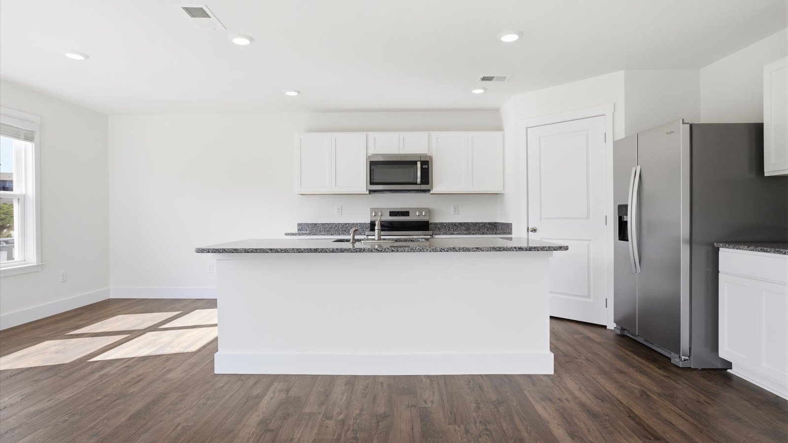 kitchen with granite island and stainless steel appliances