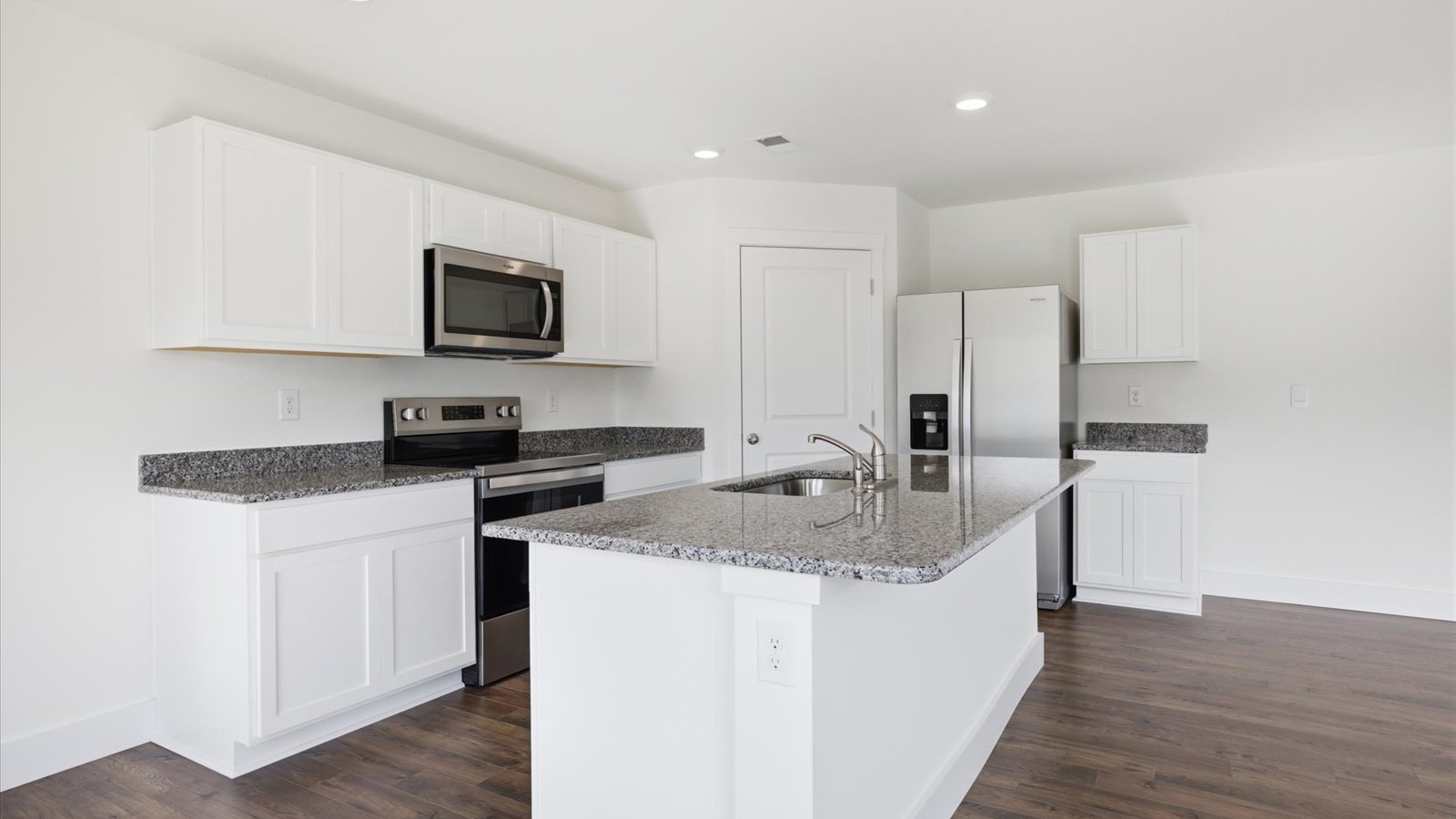 kitchen with granite island and stainless steel appliances