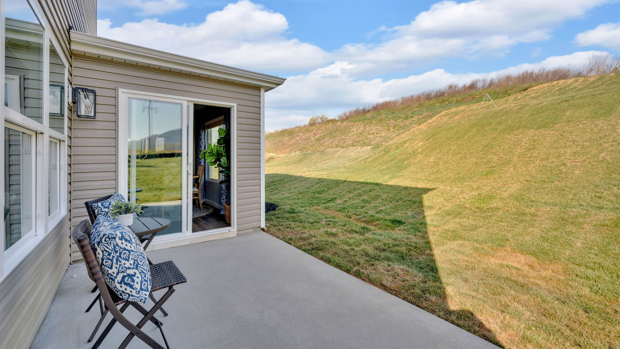 Exterior of home with patio.