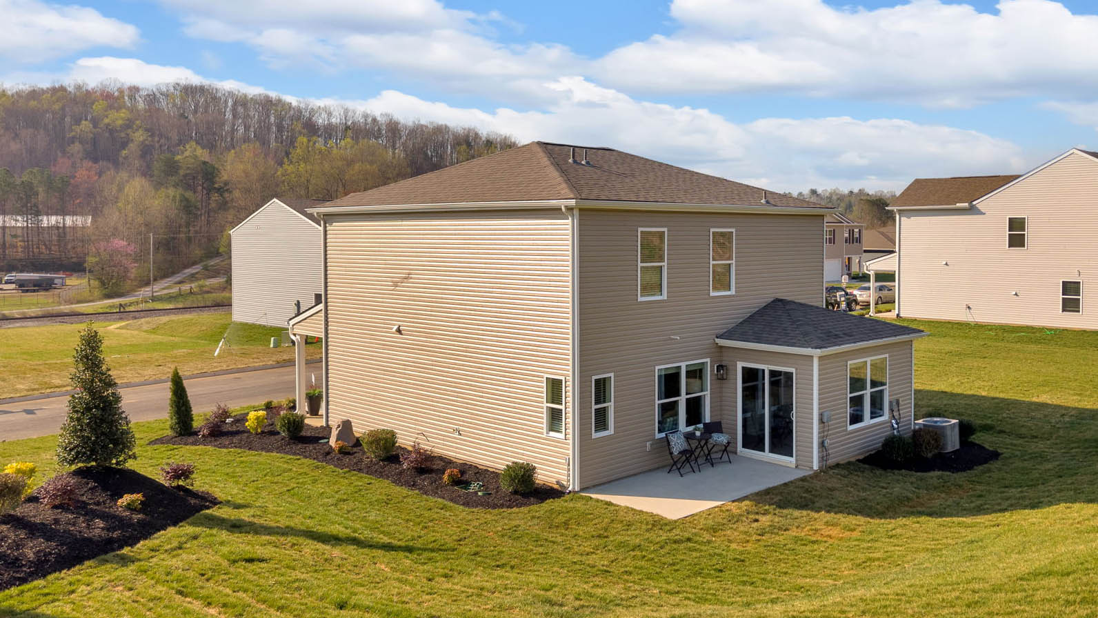 Exterior of home with rolling hills.