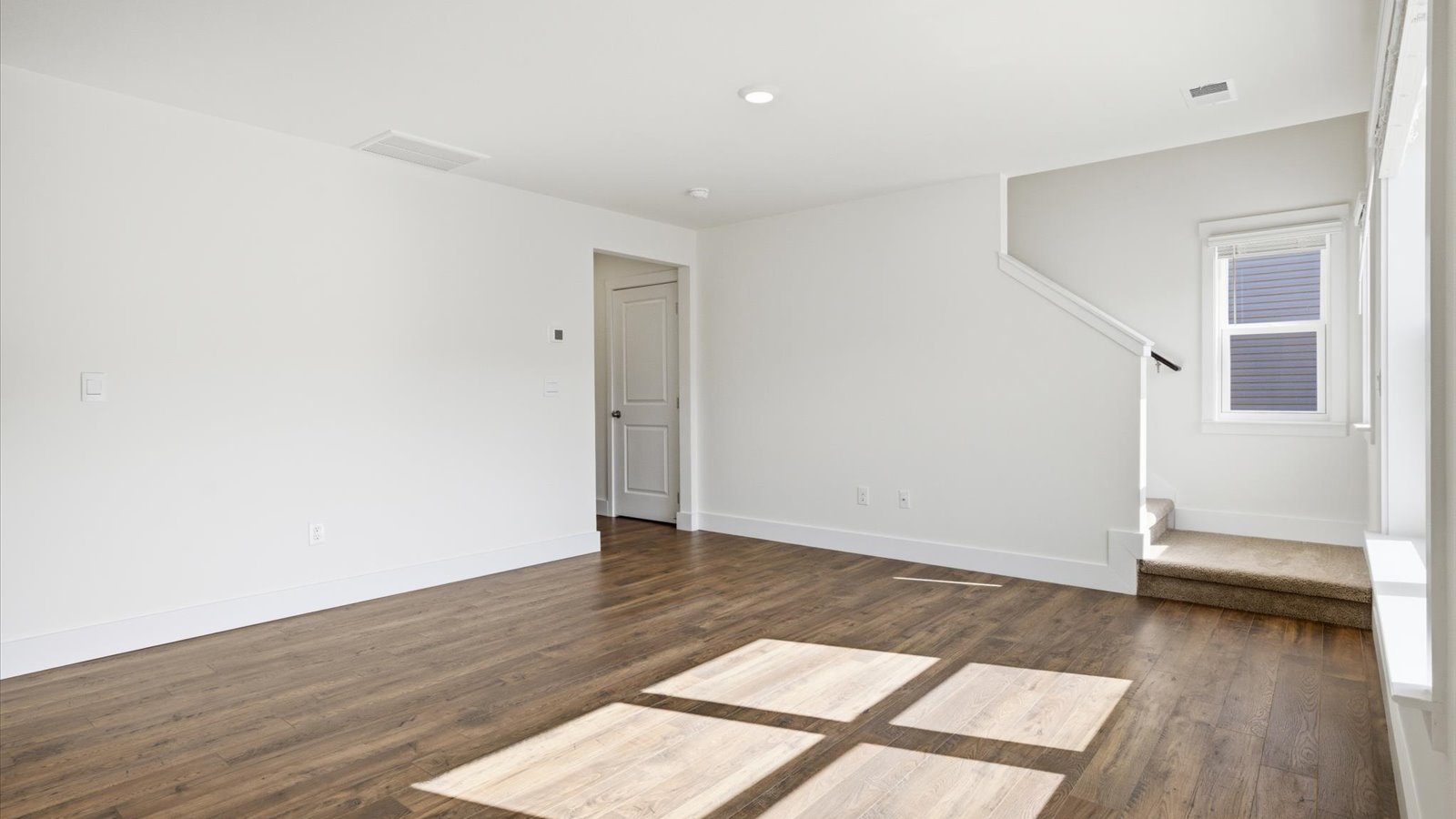 living area with large window and natural light