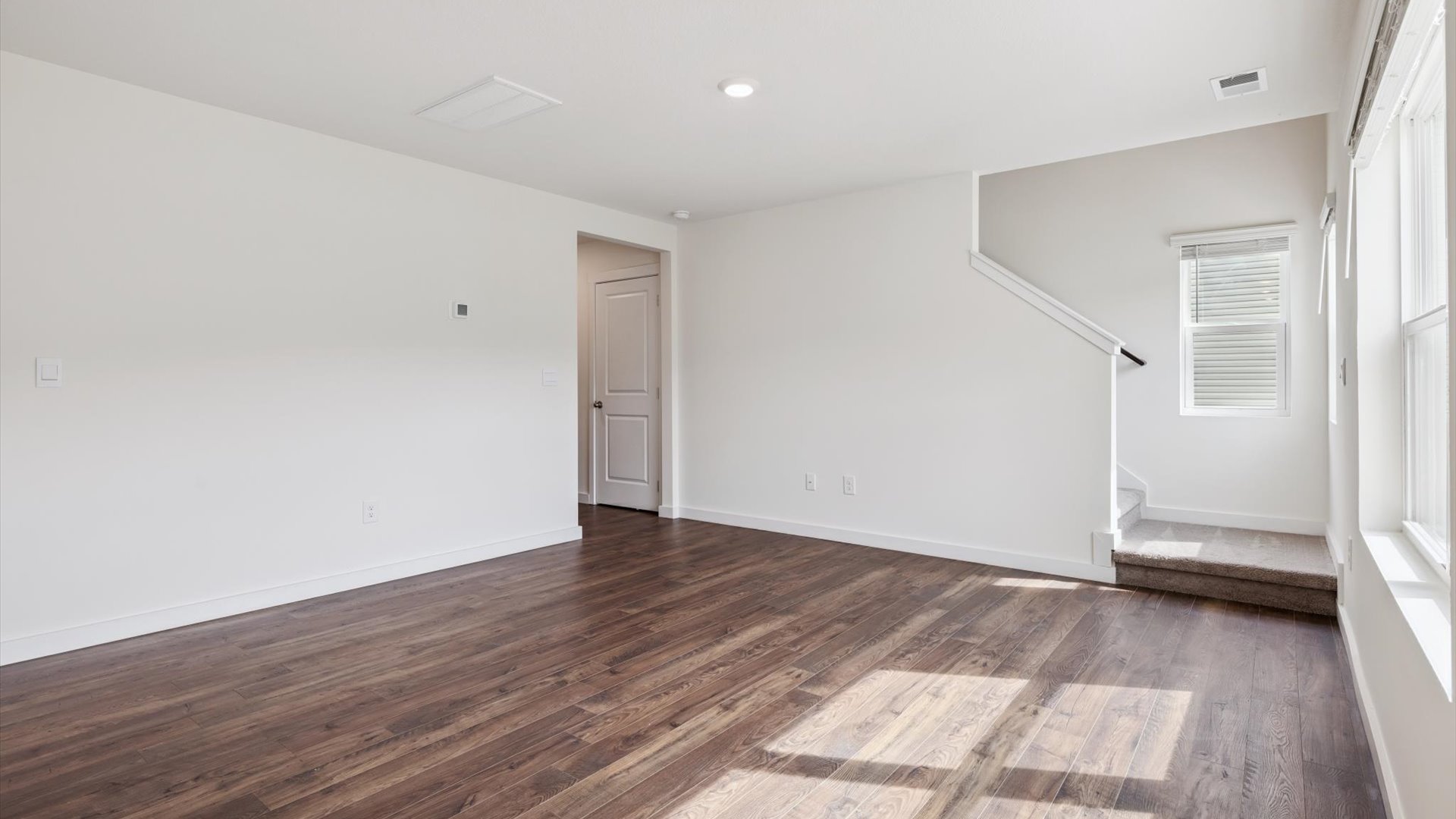 Open concept living, dining, and kitchen space