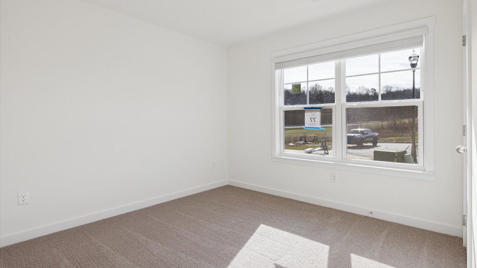 Bedroom with ample natural light and carpet floors