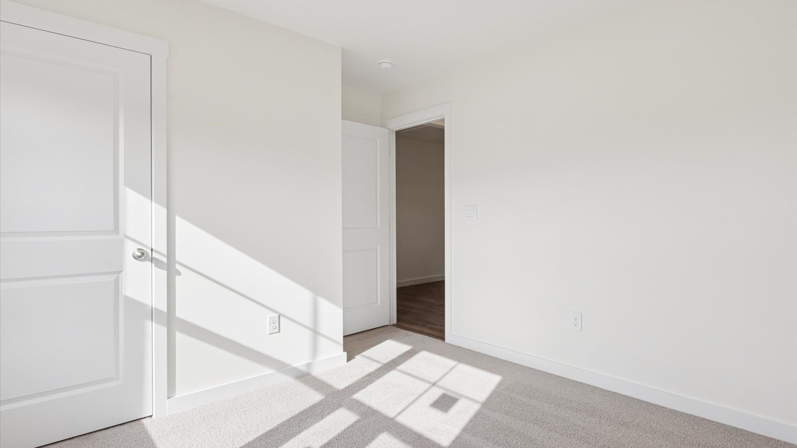 Bedroom with ample natural light and carpet floors
