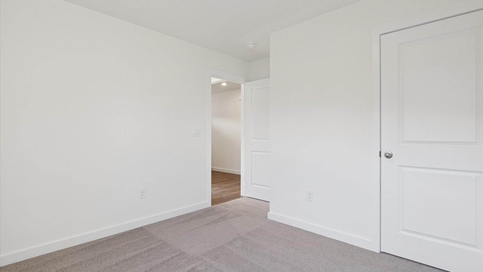 Bedroom with ample natural light and carpet floors