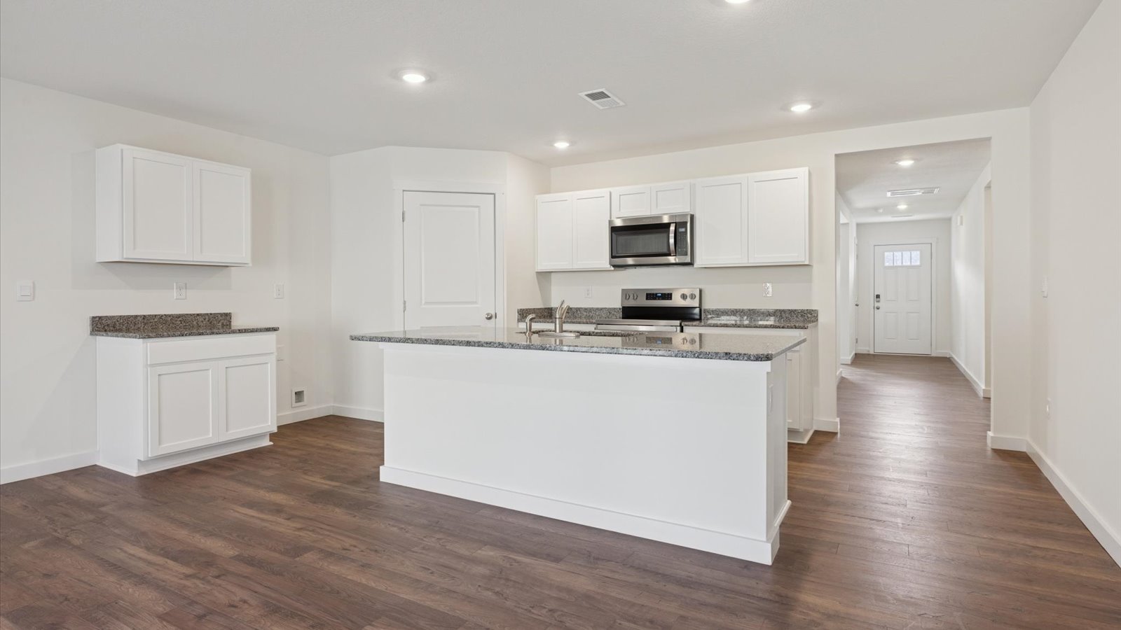 Open concept living, dining, and kitchen space