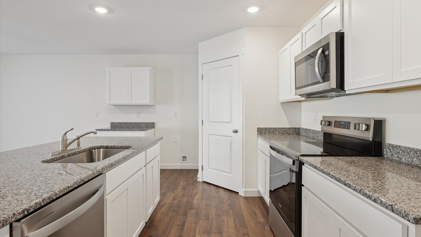 Open concept living, dining, and kitchen space