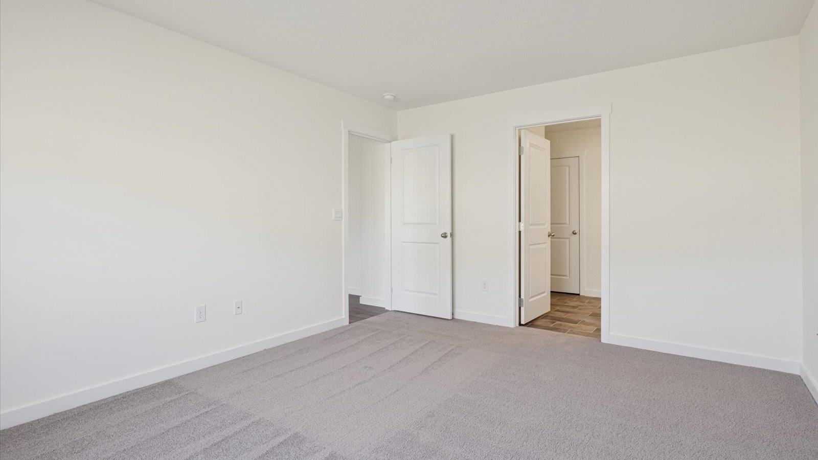 Bedroom with ample natural light and carpet floors