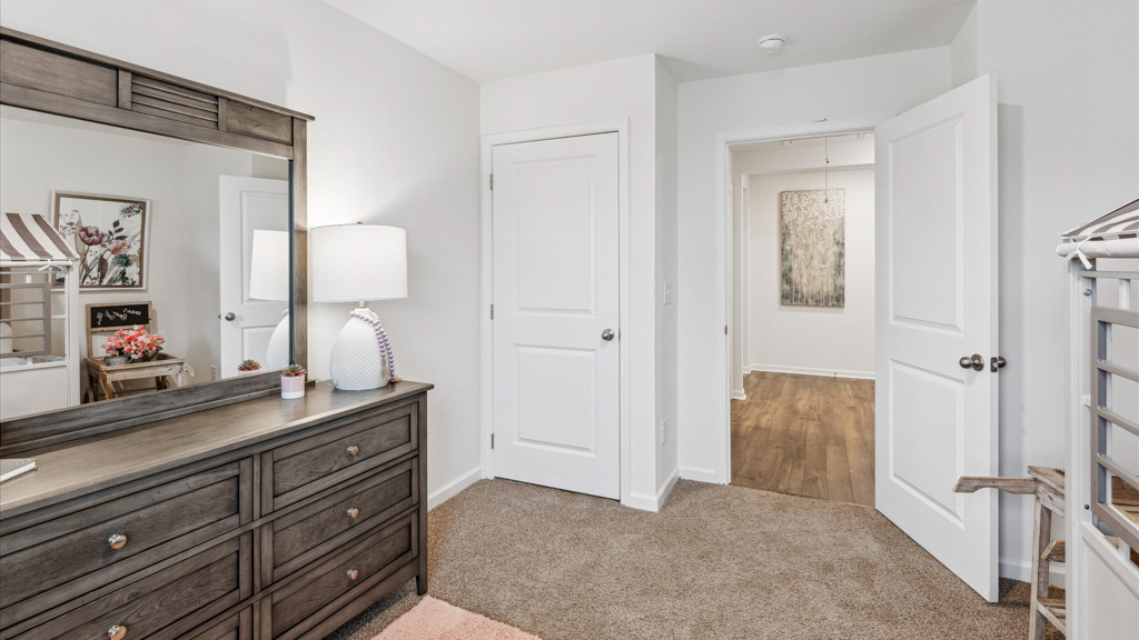 Bedroom with ample natural light and carpet floors