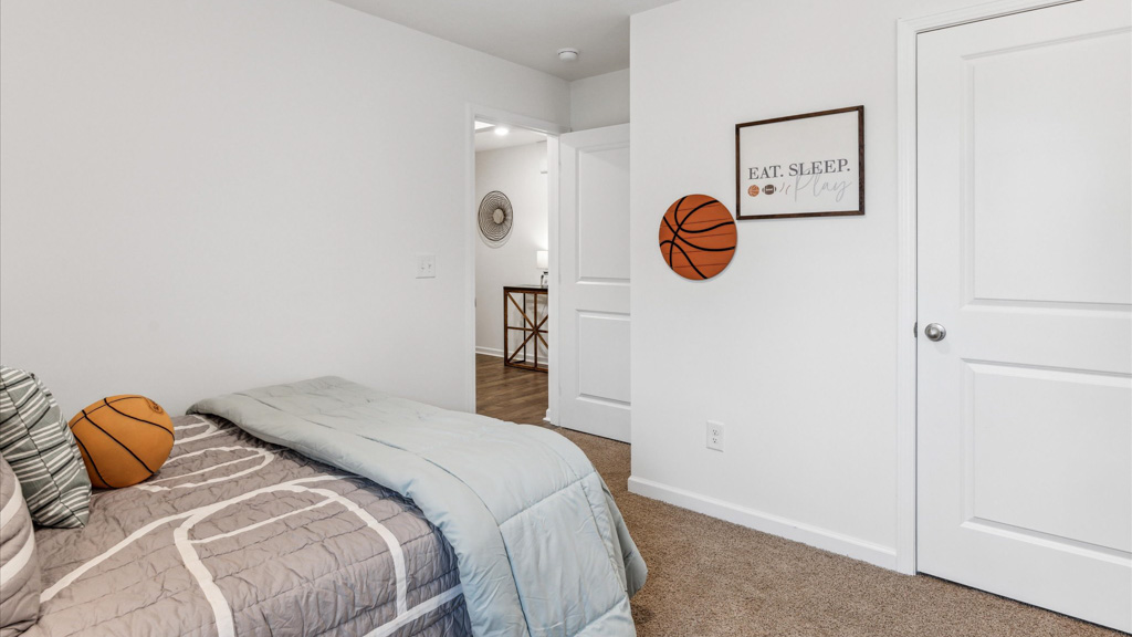 Bedroom with ample natural light and carpet floors