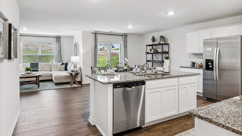 Central kitchen island with sink, seating, crafted to anchor the home, pantry, prep zones, perfect for entertaining and everyday gathering