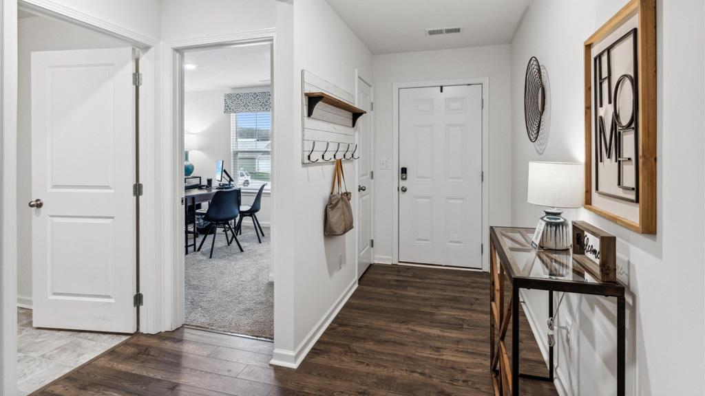A foyer, entry hall inside front door, next to office, or sitting room adding a welcoming front, direct line of sight to home