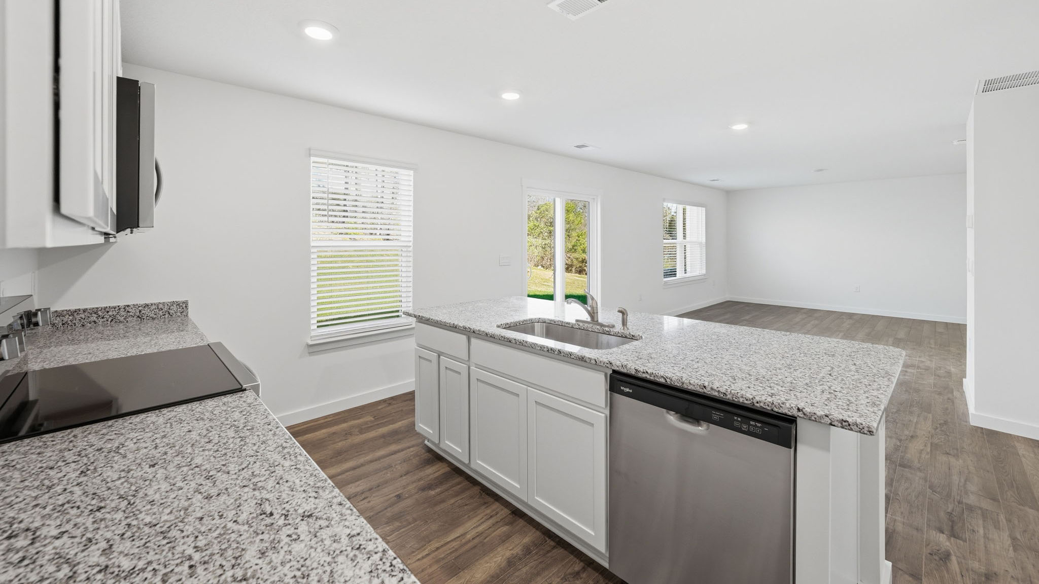 Open concept living, dining, and kitchen space