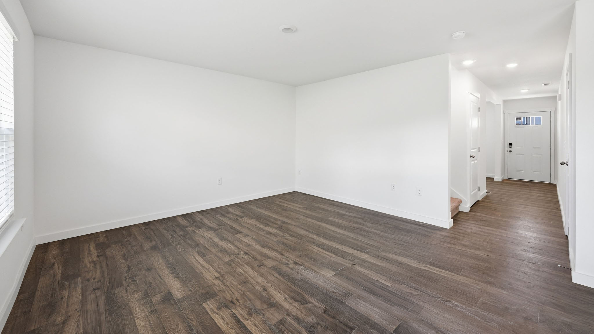 Open concept living, dining, and kitchen space