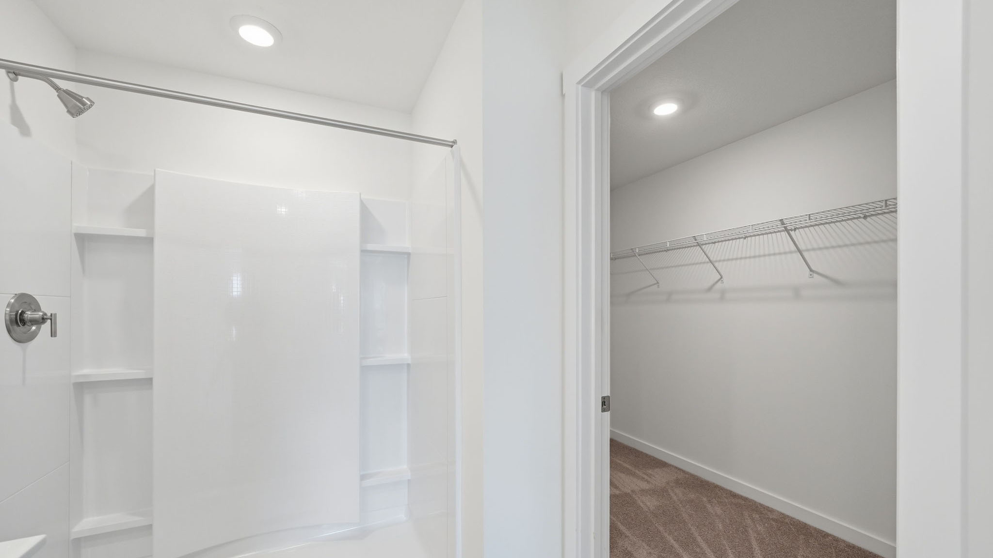Primary bathroom with double vanity and walk-in shower