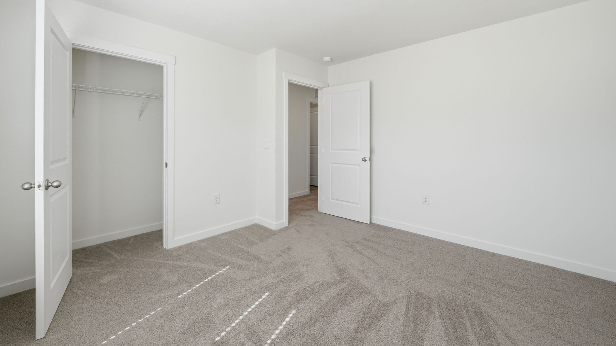 Bedroom with ample natural light and carpet floors