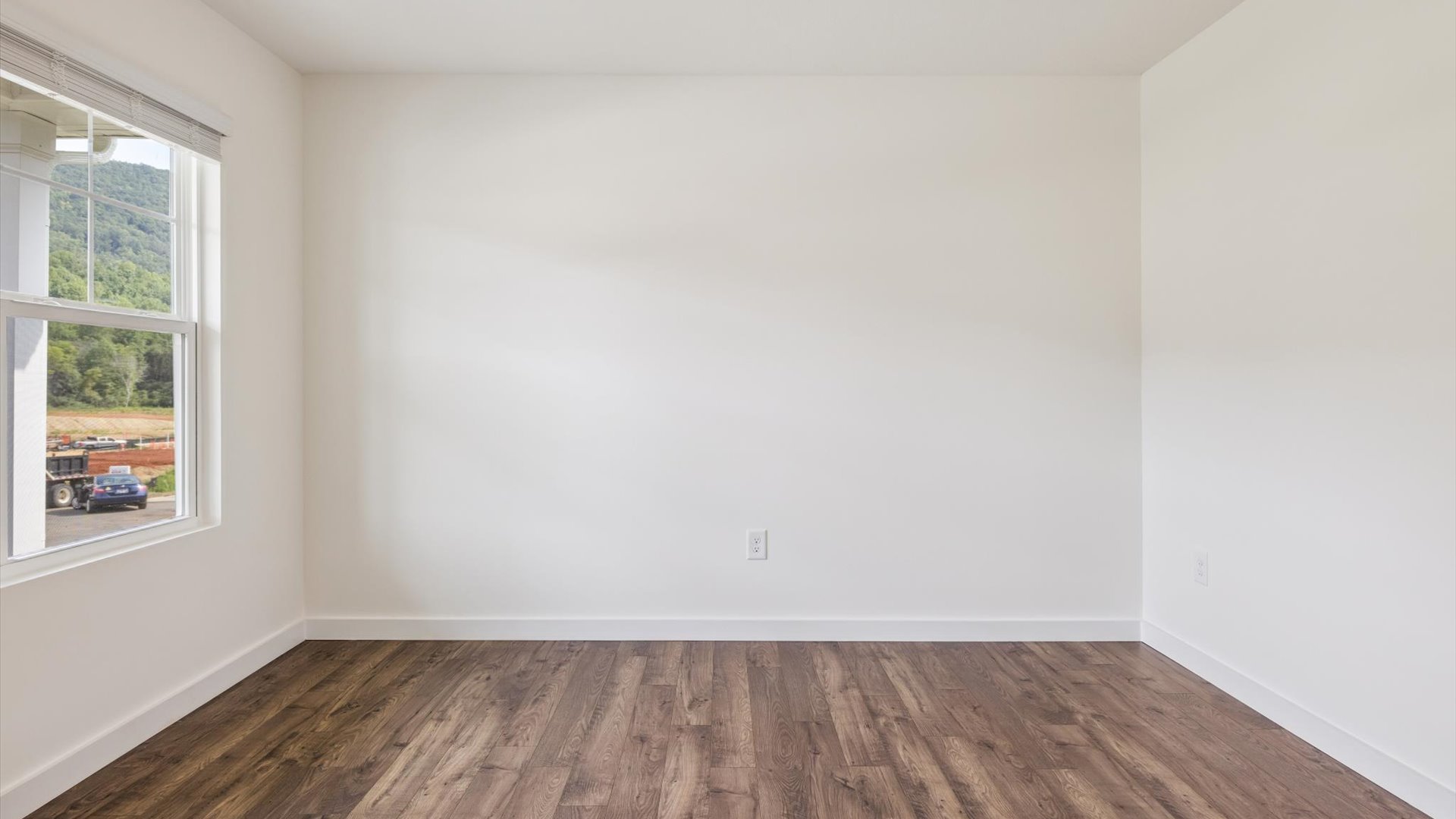 Cozy dining nook space to the side of the kitchen overlooking backyard