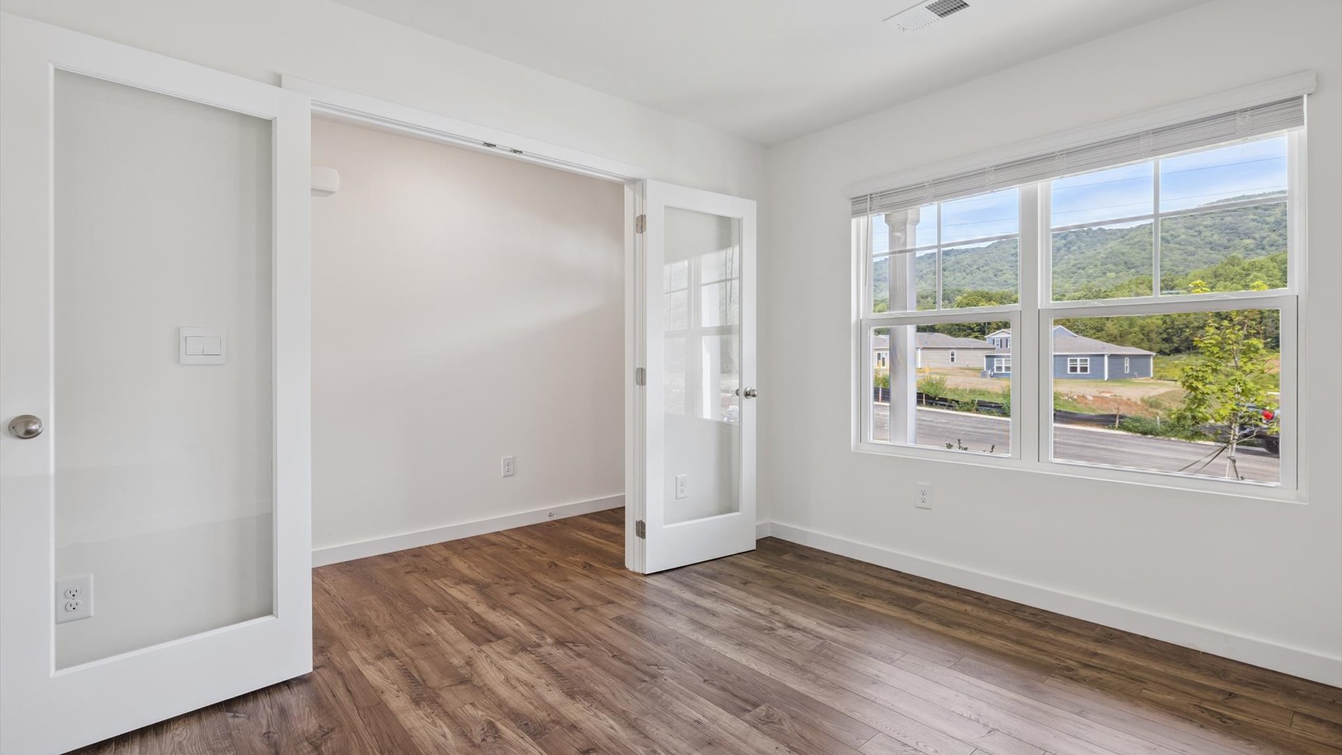 Open concept living, dining, and kitchen space