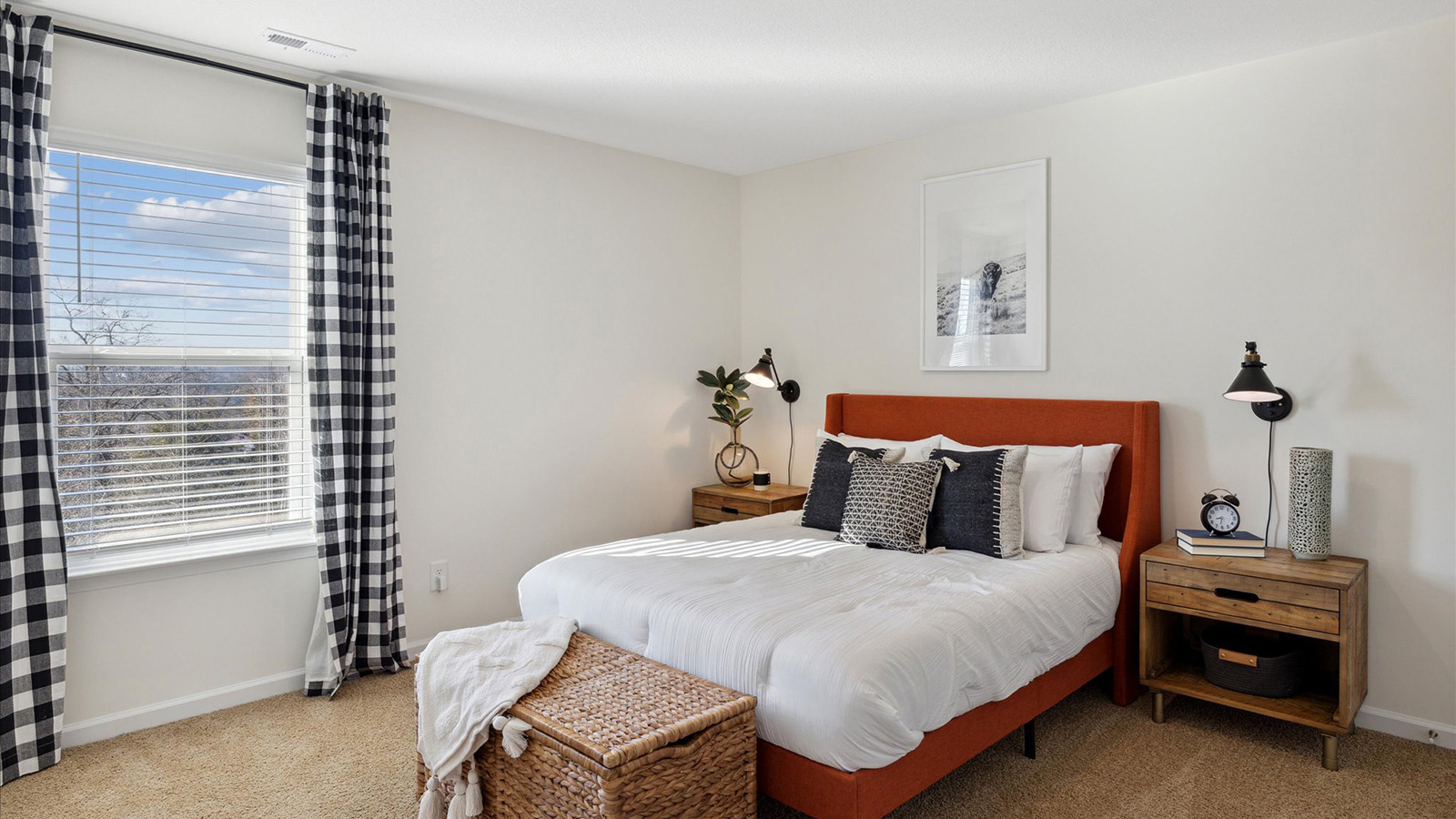 Bedroom with ample natural light and carpet floors