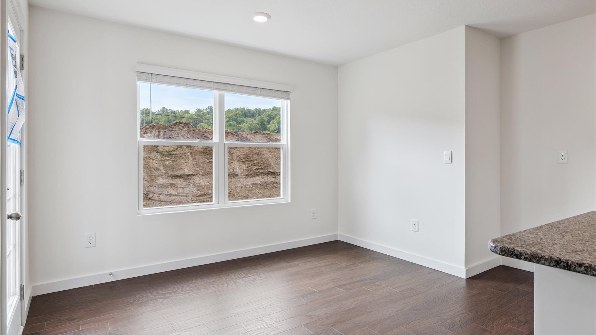 Main level living room offers a bright space and open concept connections to kitchen and living spaces