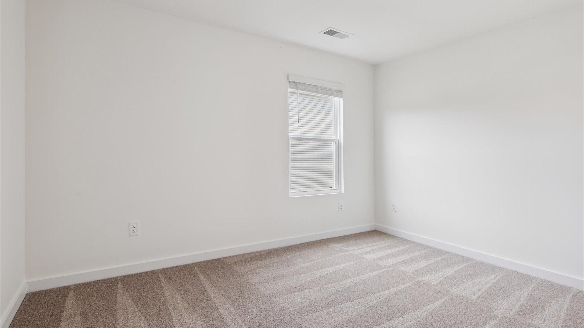 Primary bedroom designed with privacy and space in mind with a flow into a spa-inspired ensuite bathroom and walk-in closet