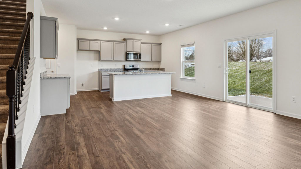 Open concept living, dining, and kitchen space