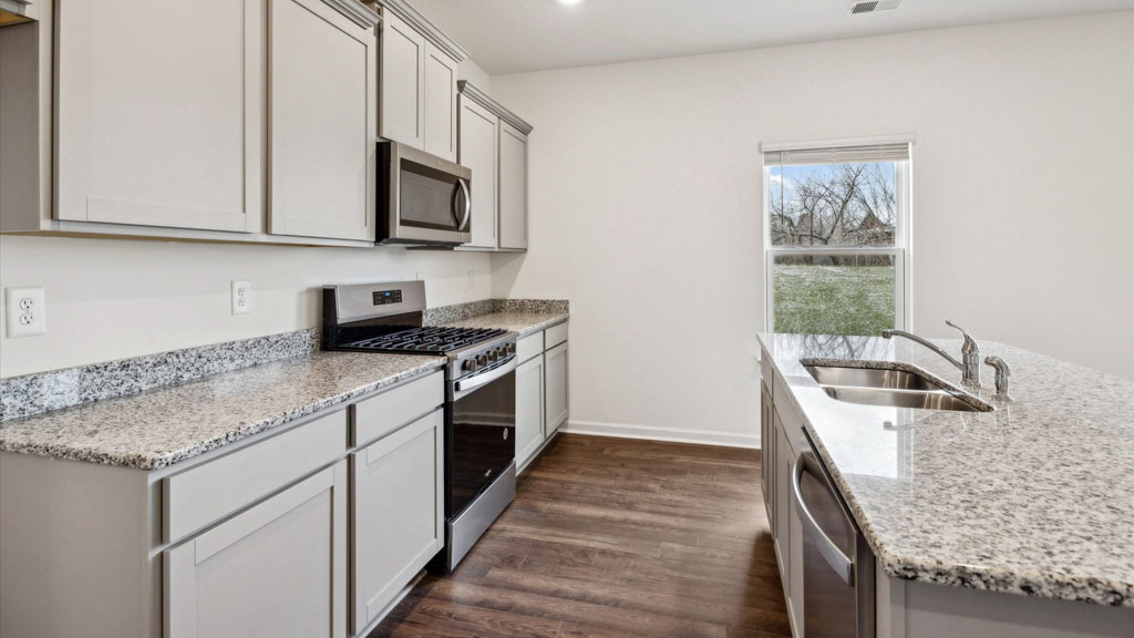 Spacious open concept kitchen with island and counter prep space