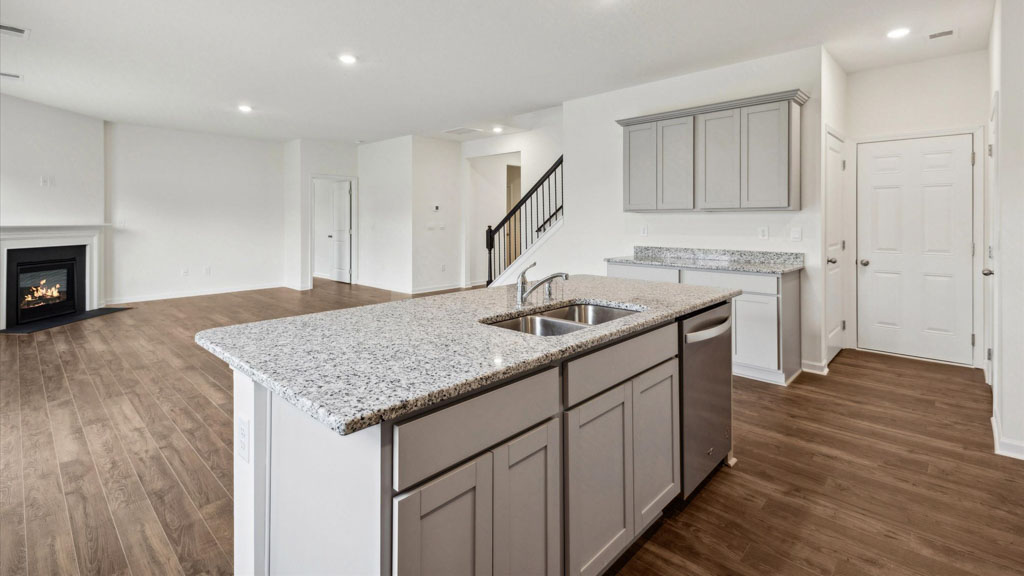 Open concept living, dining, and kitchen space