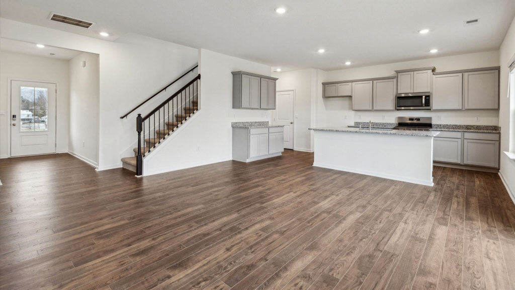 Open concept living, dining, and kitchen space