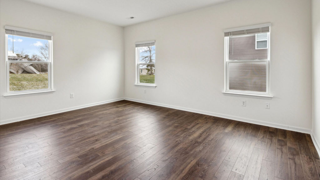 Primary bedroom with private attached bathroom and walk-in closet