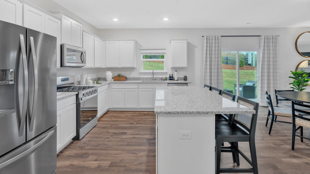 Open concept living, dining, and kitchen space