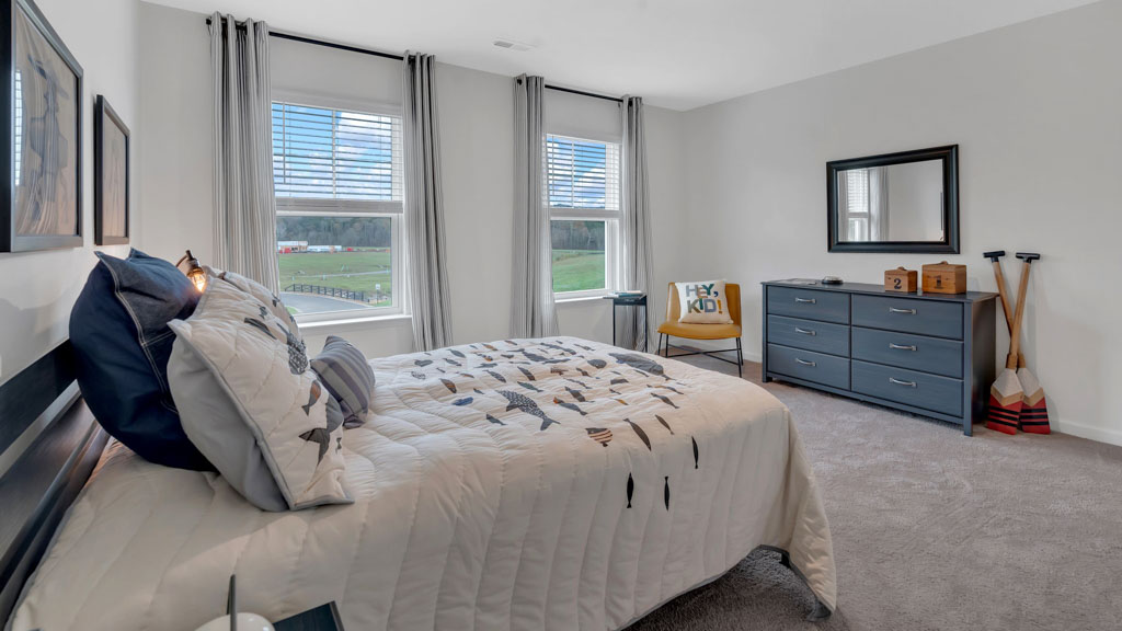 Bedroom with ample natural light and carpet floors