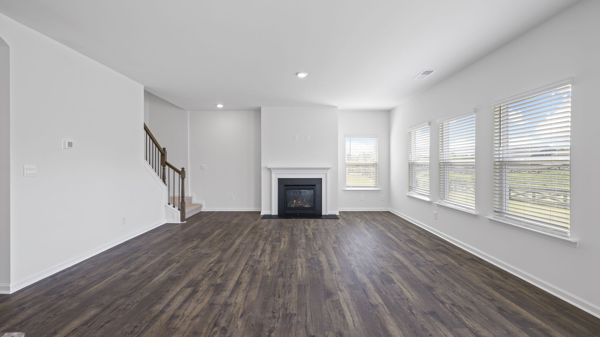 Open concept living, dining, and kitchen space