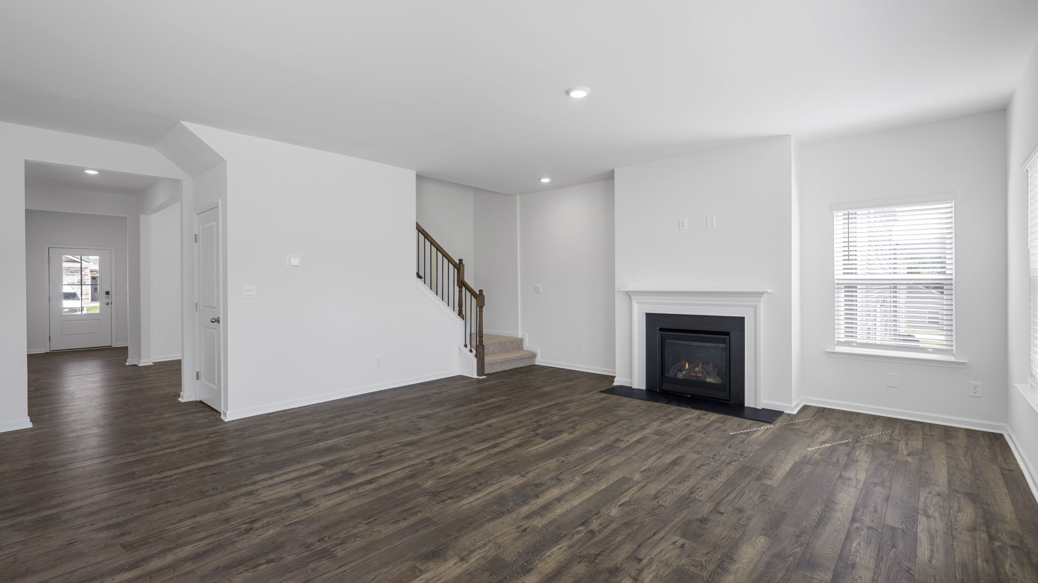 Open concept living, dining, and kitchen space