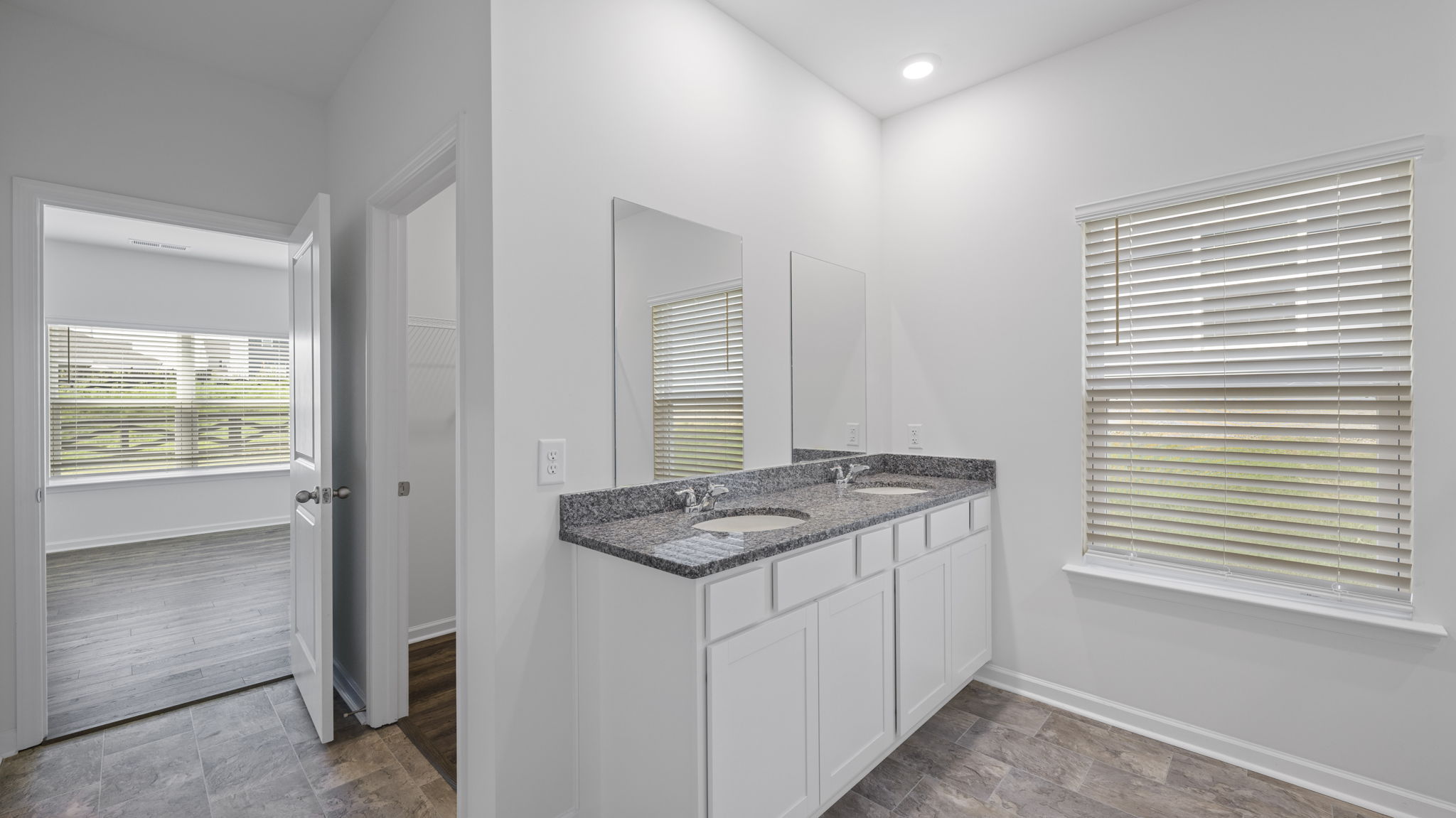 Primary bathroom with double vanity and walk-in shower