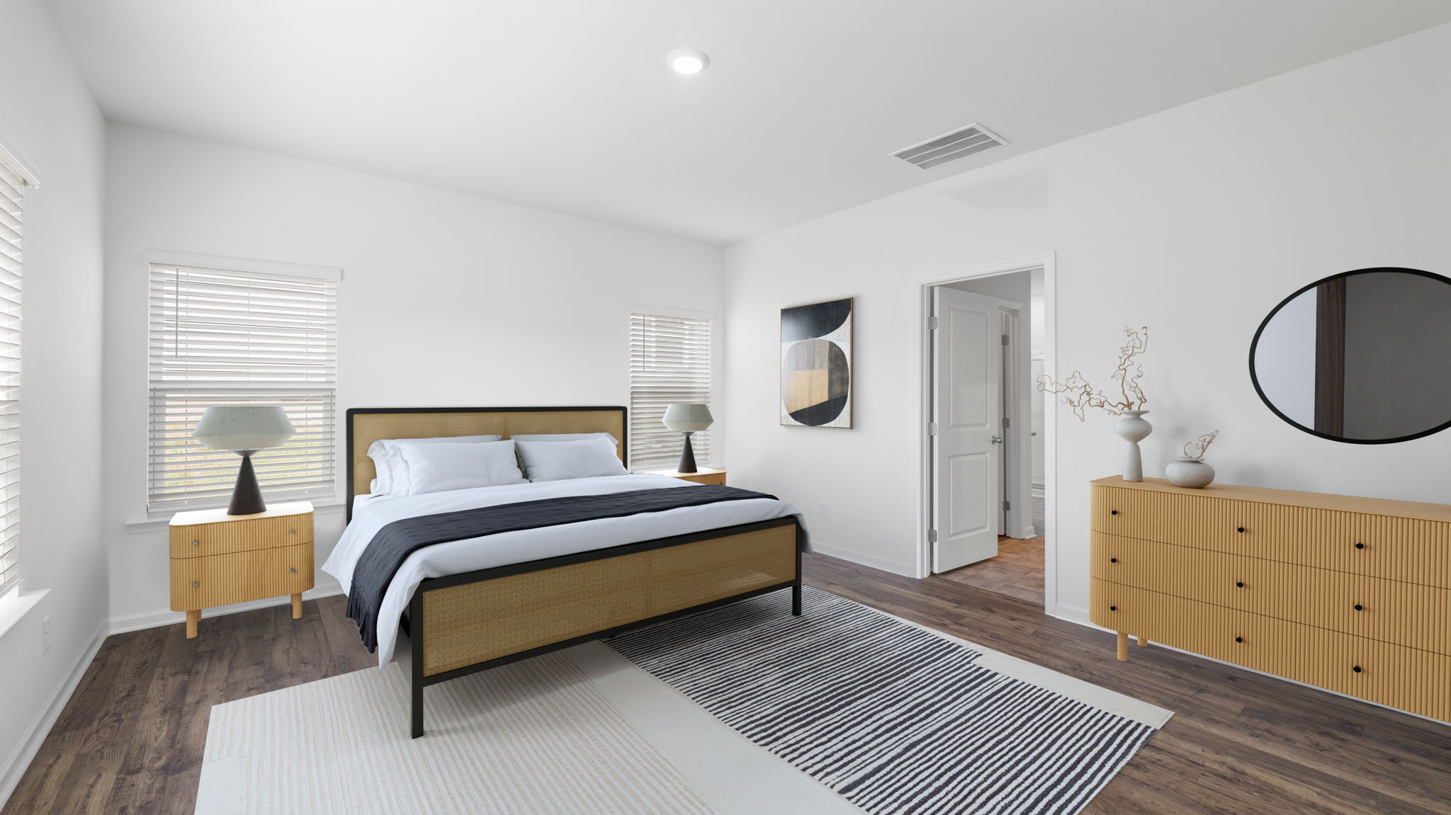 Primary bedroom with private attached bathroom and walk-in closet