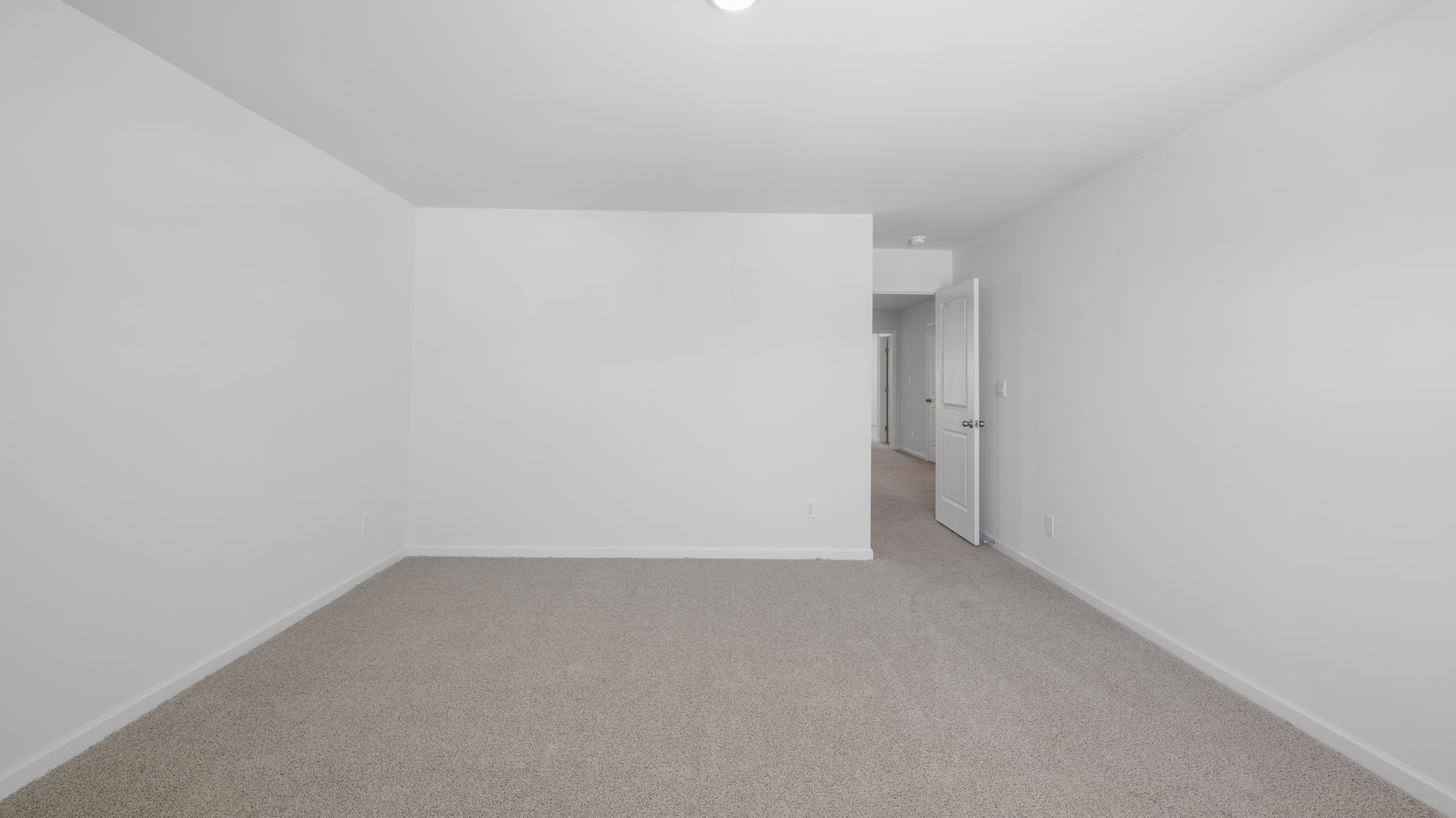 Bedroom with ample natural light and carpet floors