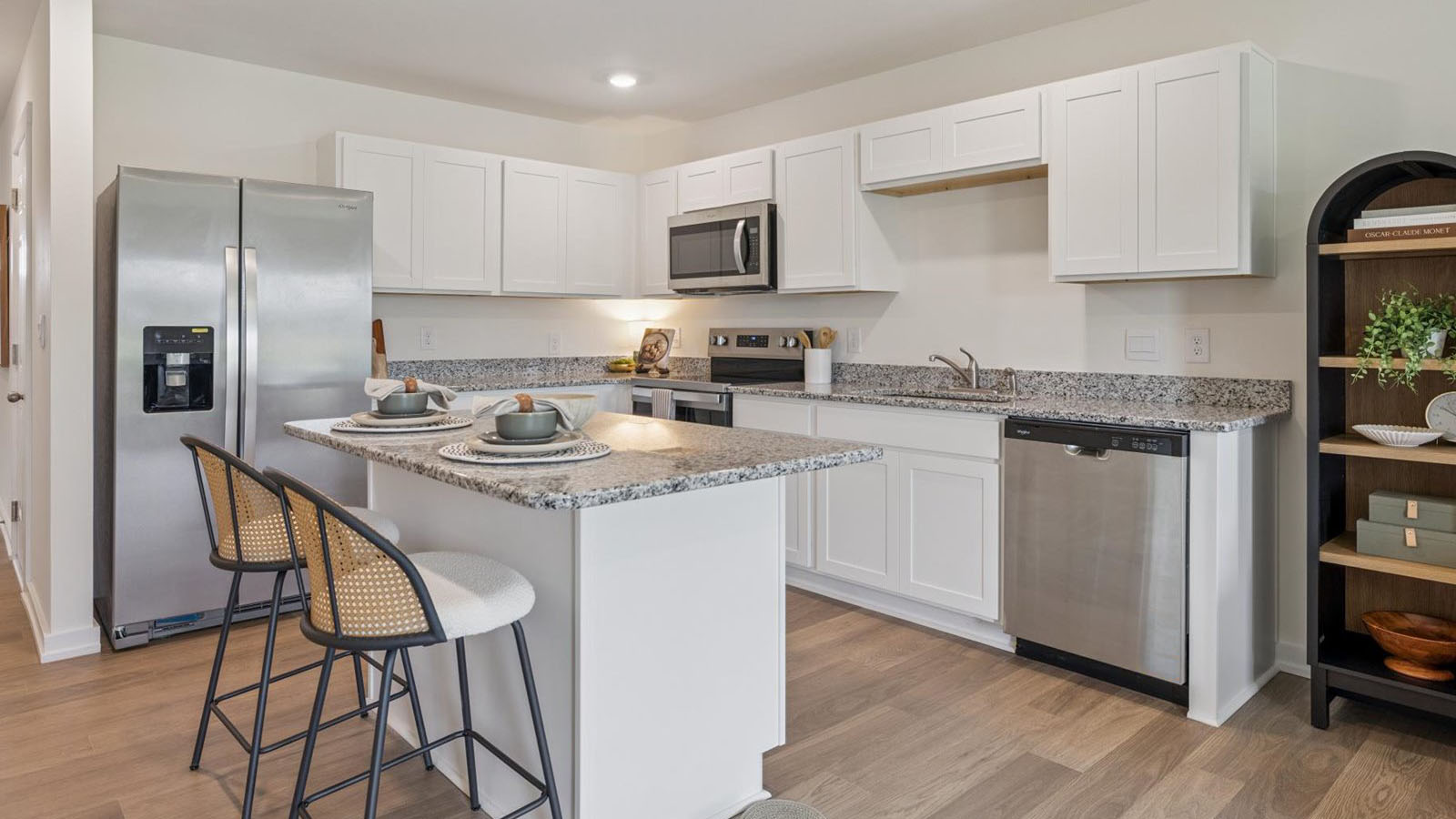 Open concept living, dining, and kitchen space